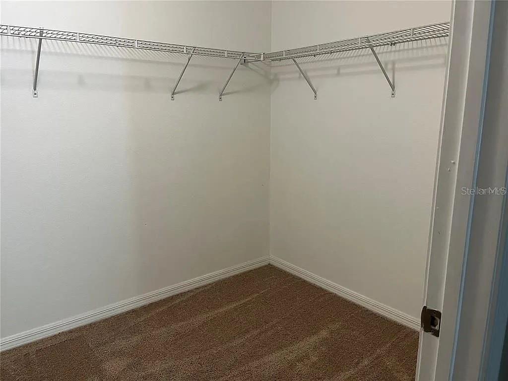 1606 Redmond Brook Lane Ruskin, FL 33570 - Photo 16 of 26 a view of a room with racks on the wall