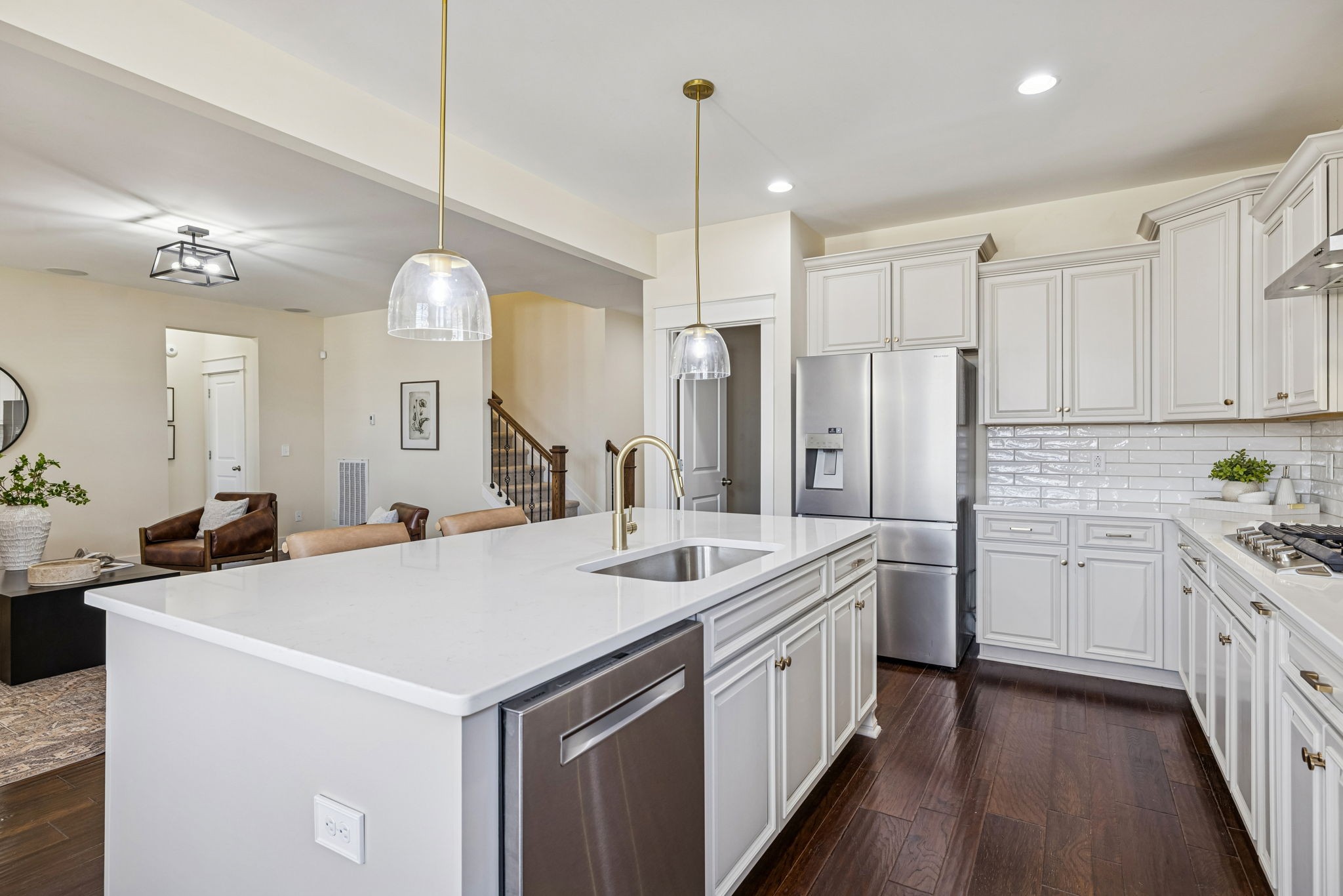 737 Newcomb Street Franklin, TN 37064 - Photo 24 of 99 a kitchen with stainless steel appliances a sink a stove a refrigerator and island with wooden floor