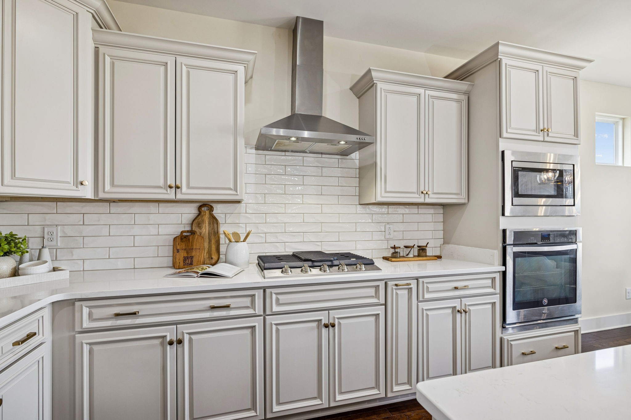 737 Newcomb Street Franklin, TN 37064 - Photo 27 of 99 a kitchen with stainless steel appliances granite countertop a sink stove and cabinets
