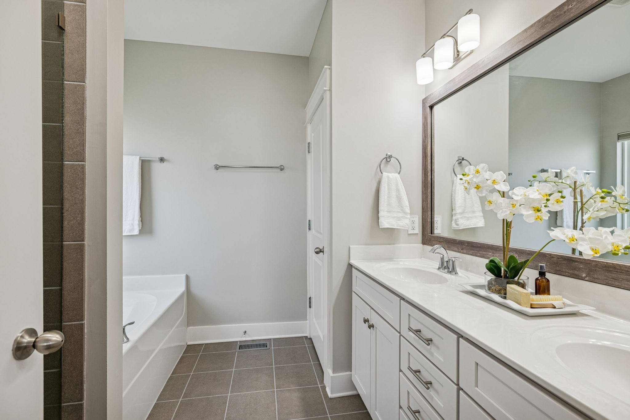 737 Newcomb Street Franklin, TN 37064 - Photo 48 of 99 a spacious bathroom with a double vanity sink a mirror and a shower