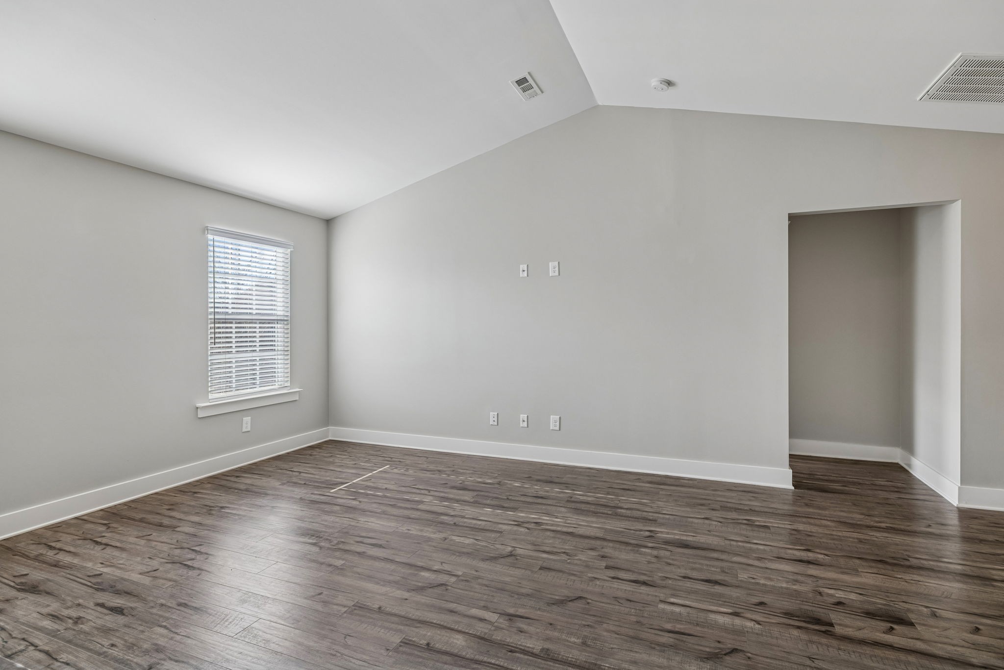 737 Newcomb Street Franklin, TN 37064 - Photo 62 of 99 a view of an empty room with wooden floor and a window