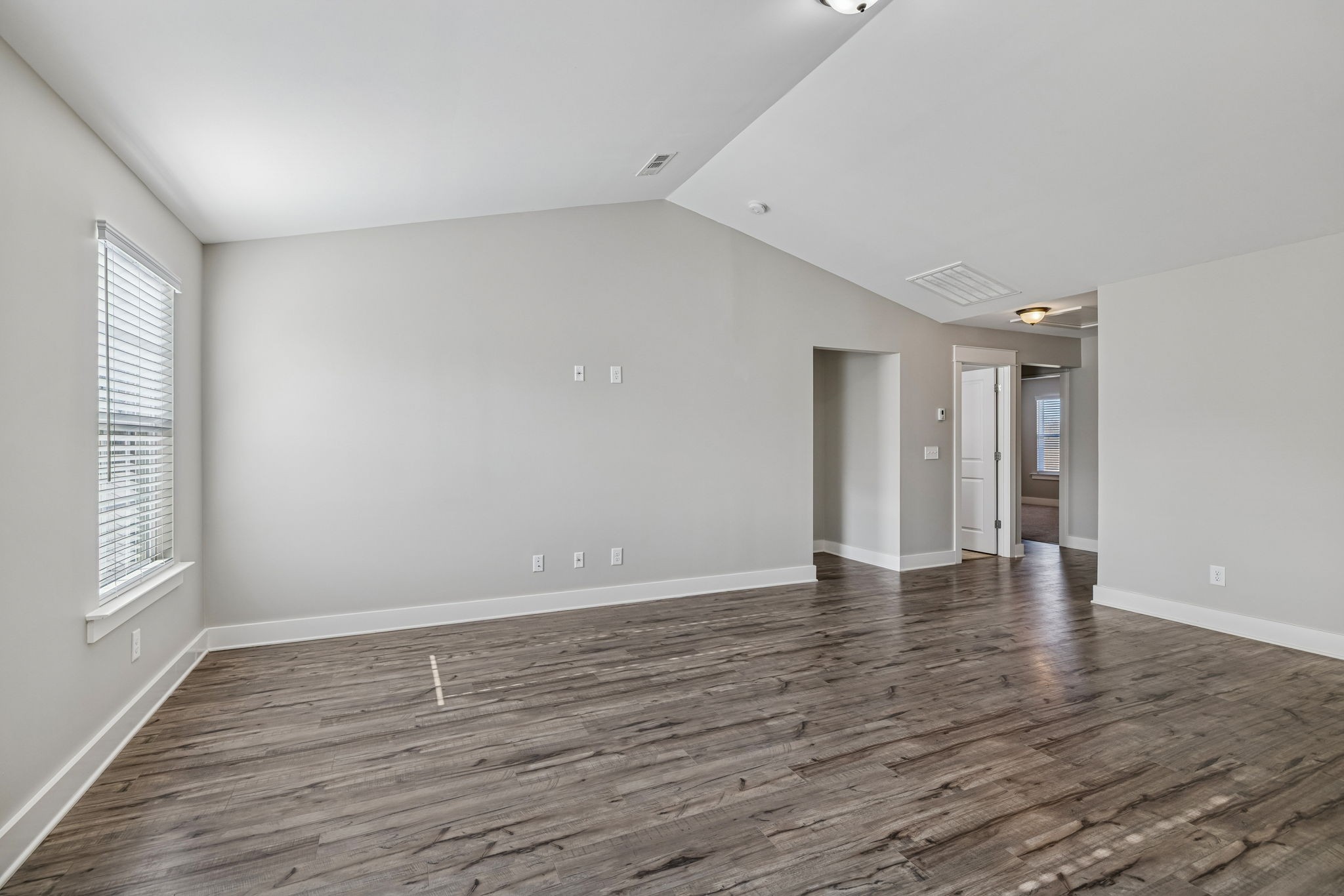 737 Newcomb Street Franklin, TN 37064 - Photo 63 of 99 a view of an empty room with wooden floor and window