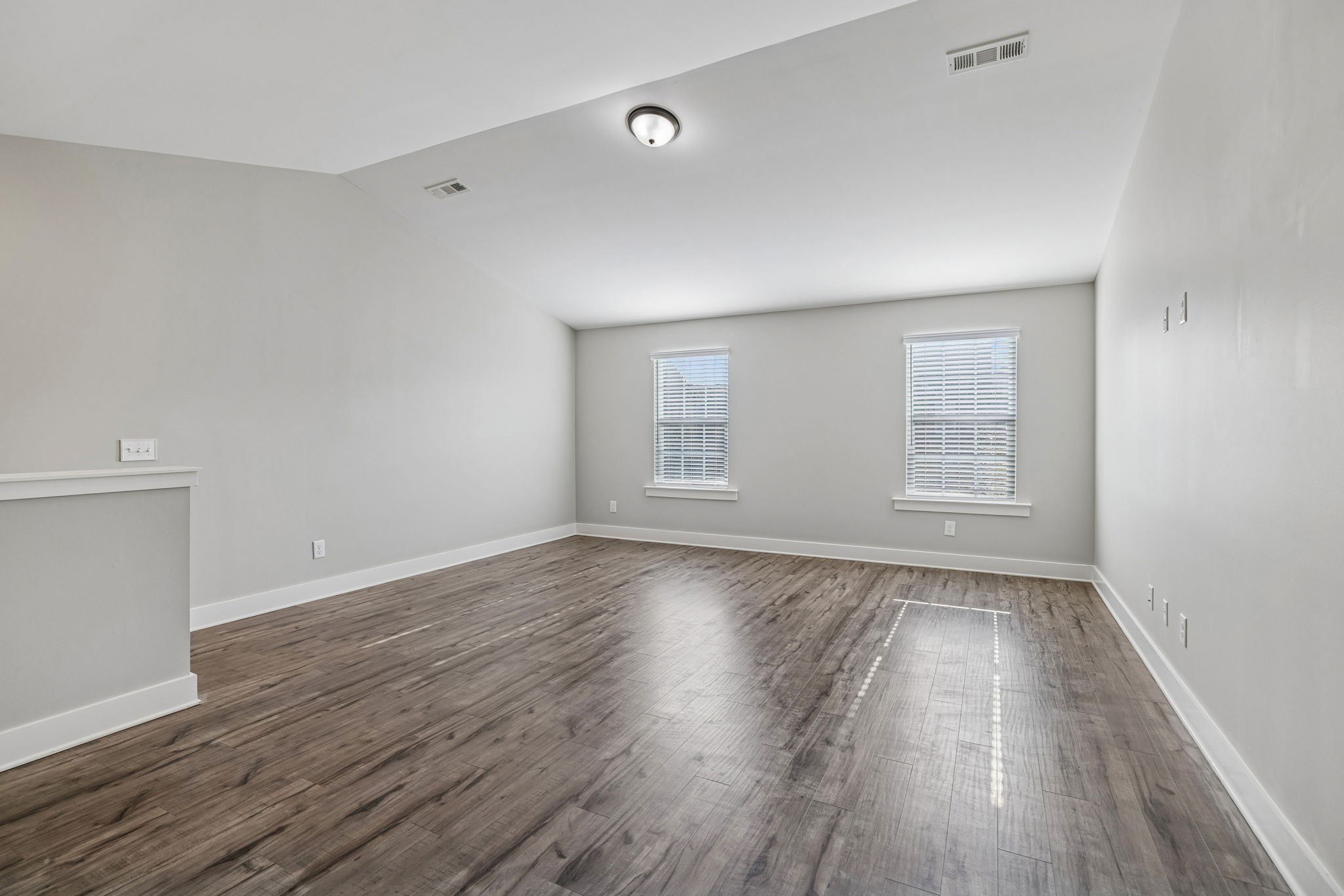 737 Newcomb Street Franklin, TN 37064 - Photo 65 of 99 a view of an empty room with wooden floor and a window