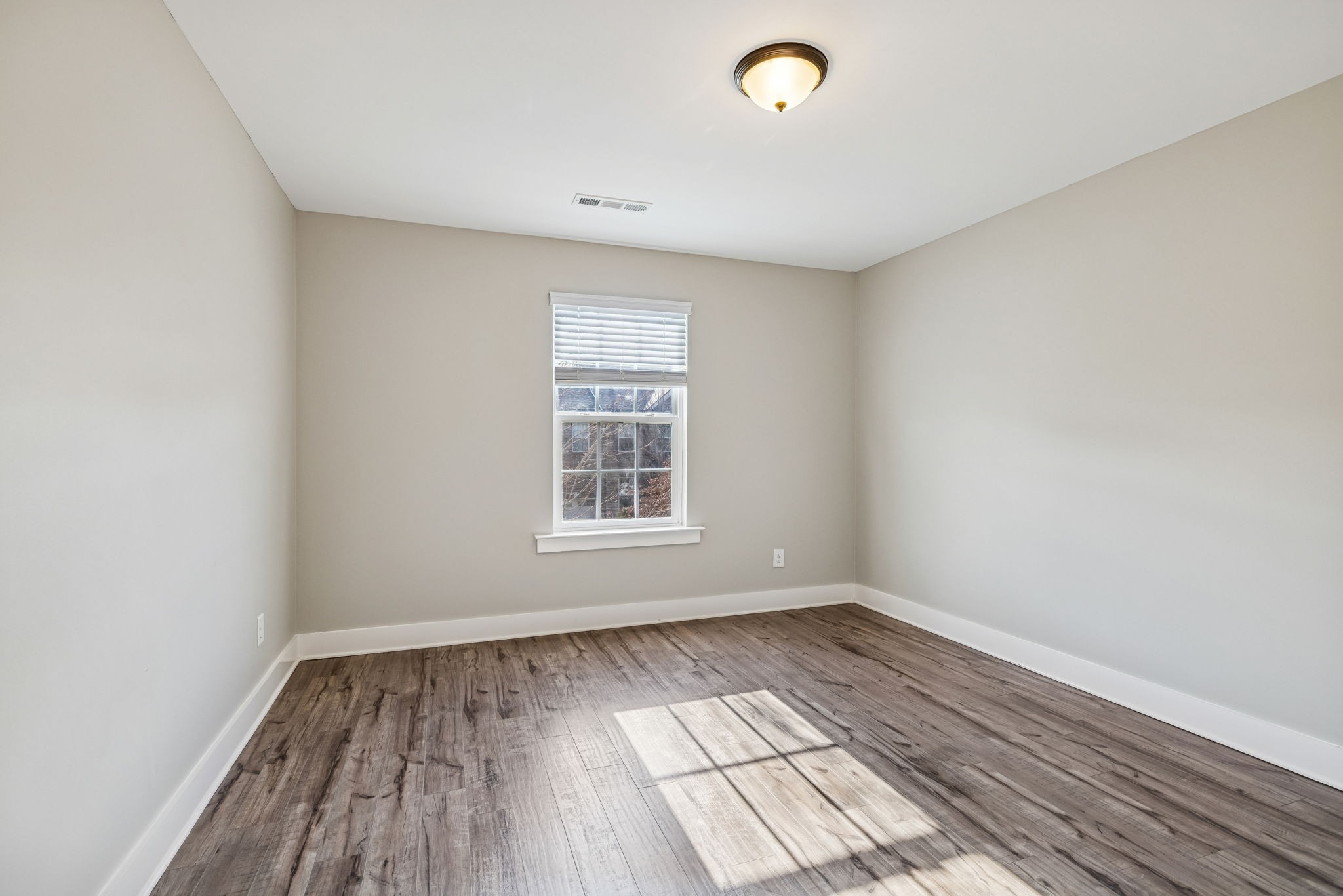 737 Newcomb Street Franklin, TN 37064 - Photo 67 of 99 an empty room with wooden floor and windows
