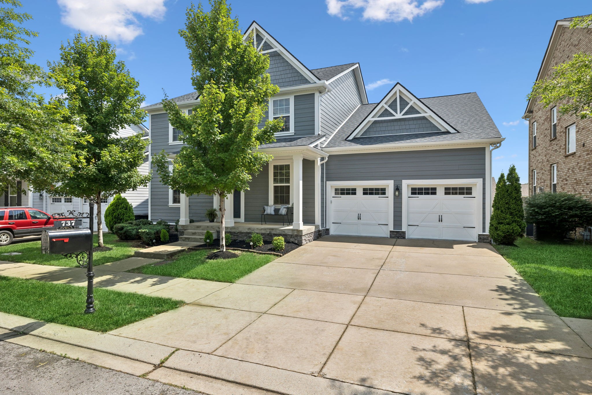 737 Newcomb Street Franklin, TN 37064 - Photo 79 of 99 a front view of a house with a yard and trees