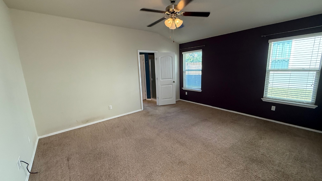 116 Zoisite Lane Jarrell, TX 76537 - Photo 11 of 21 an empty room with a window and a fan
