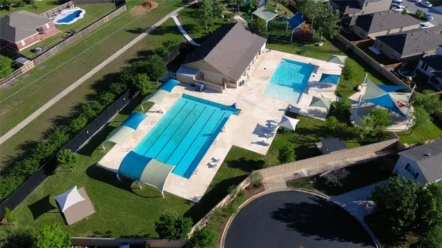 an aerial view of a house with outdoor space