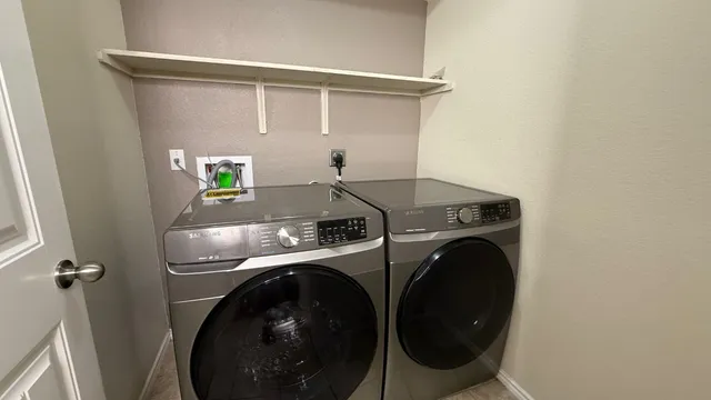 a utility room with dryer and washer