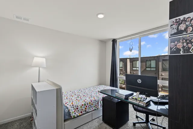 a living room with furniture a table and a window
