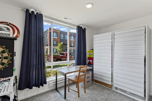 a view of a livingroom with furniture and front door
