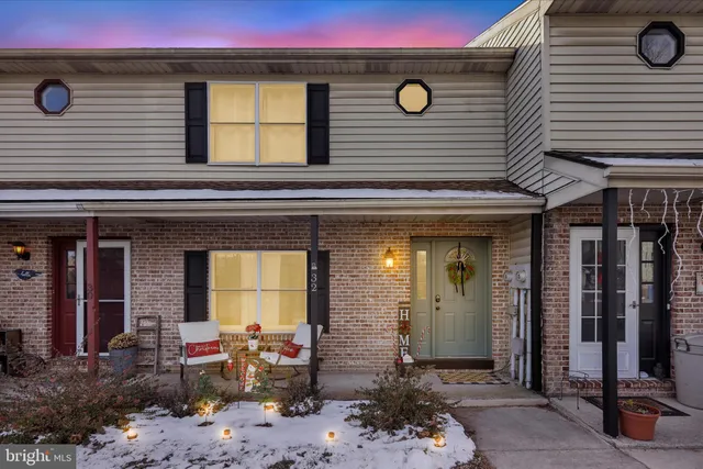 a view of a house with outdoor seating