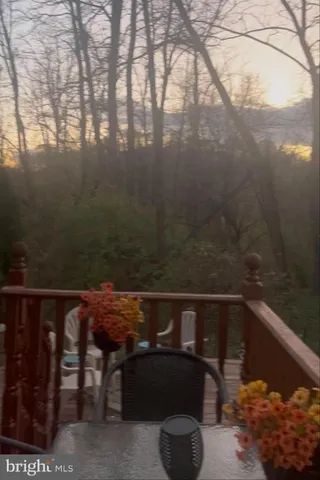 a view of balcony with wooden floor