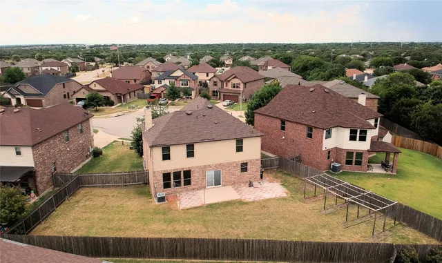an aerial view of a house with swimming pool