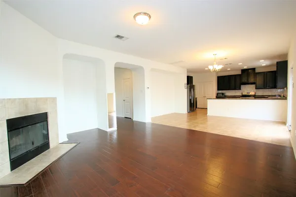 a view of a kitchen with a sink and a fireplace