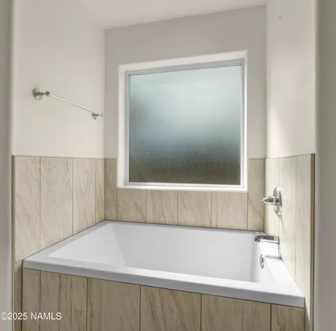 a bathroom with a bathtub