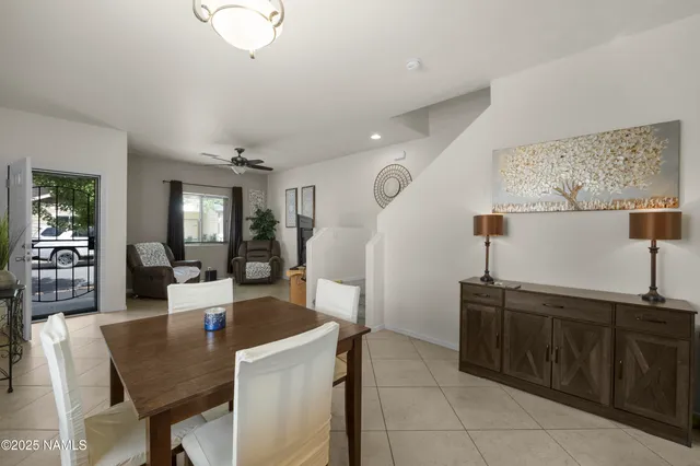 a kitchen with a table and chairs