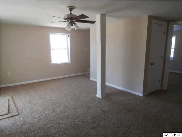 287 Shores Road Palmyra, VA 22963 - Photo 10 of 30 Family room with new carpet and access to carport, full windows