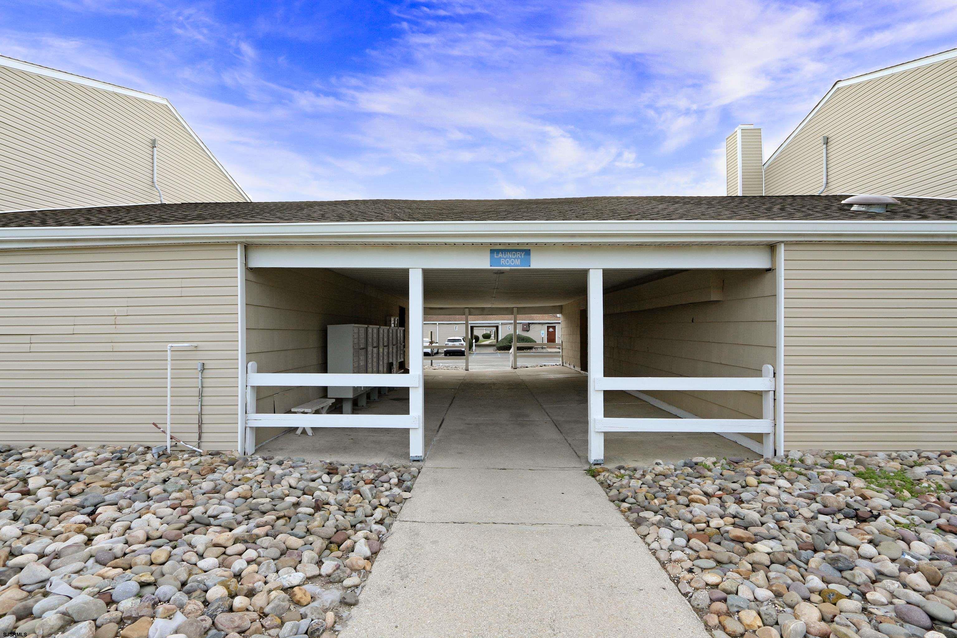 4901 Harbor Beach Boulevard, Unit P8 Brigantine, NJ 08203 - Photo 17 of 39 a front view of a house with a window
