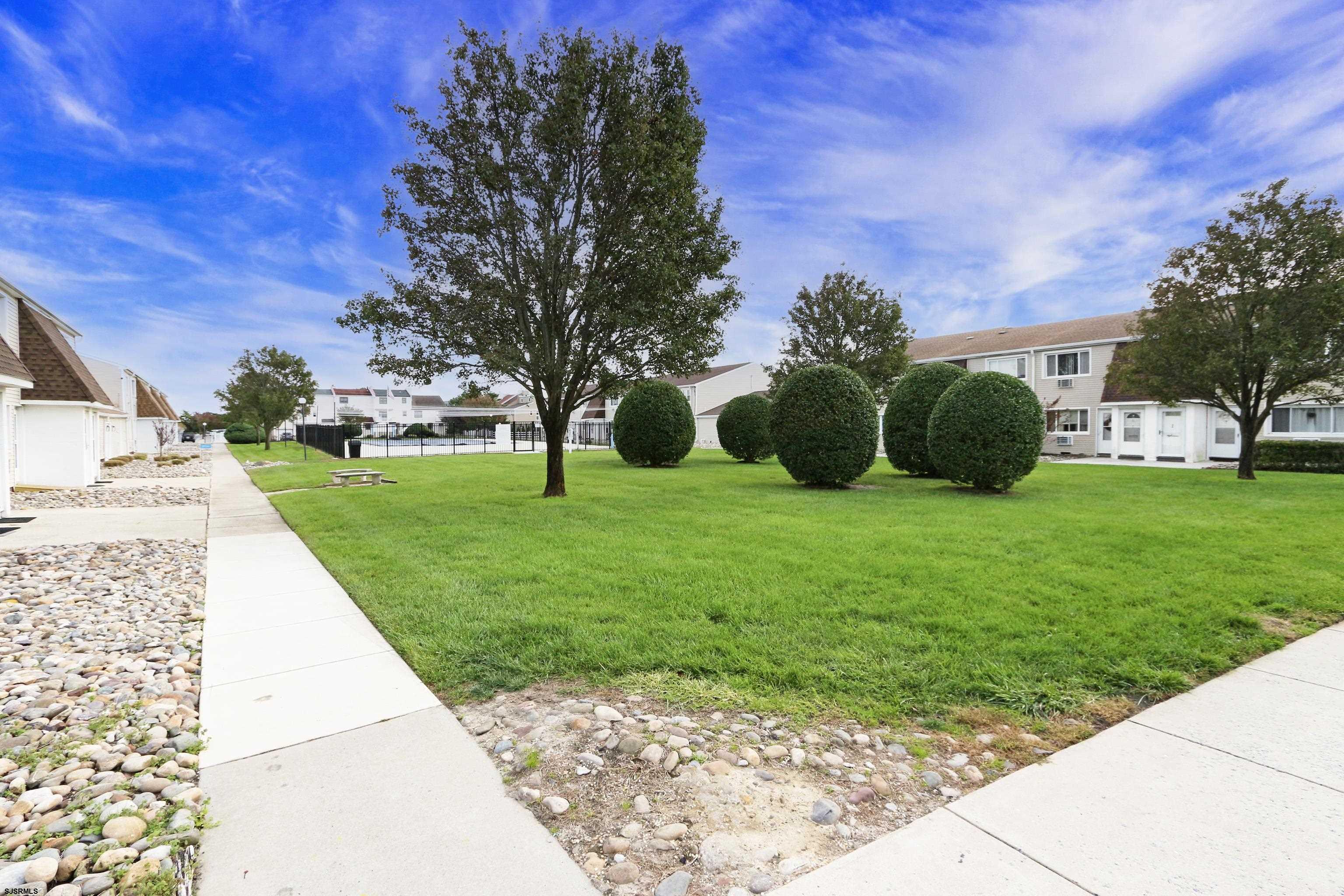 4901 Harbor Beach Boulevard, Unit P8 Brigantine, NJ 08203 - Photo 21 of 39 a view of a garden with an outdoor seating