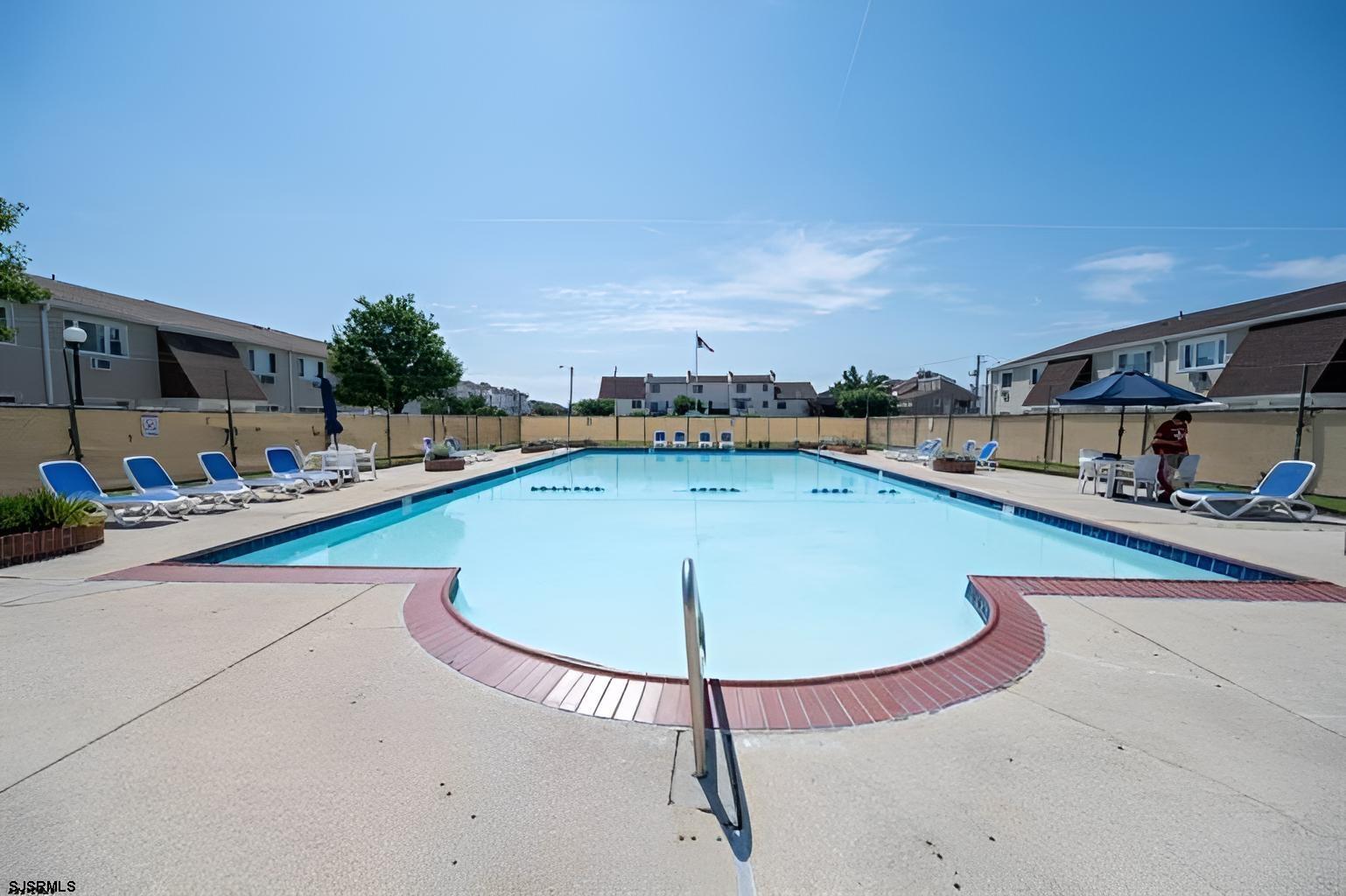 4901 Harbor Beach Boulevard, Unit P8 Brigantine, NJ 08203 - Photo 3 of 39 a view of a swimming pool with an outdoor seating