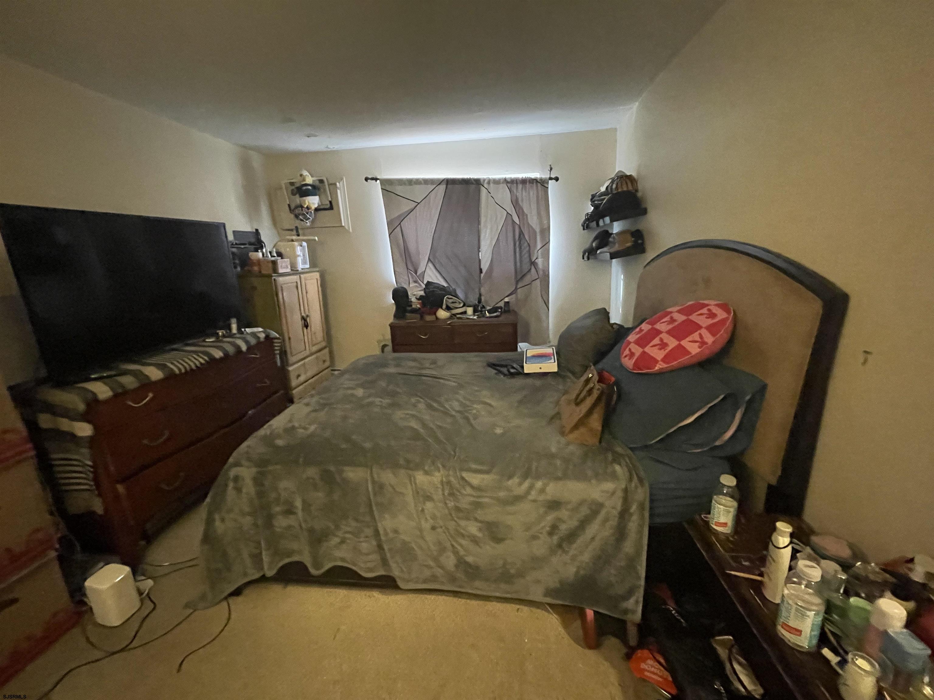 4901 Harbor Beach Boulevard, Unit P8 Brigantine, NJ 08203 - Photo 10 of 39 a living room with furniture and a flat screen tv