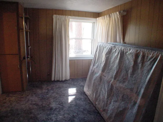 a view of a door and chair in a room