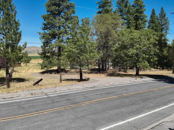 a view of a road with a houses