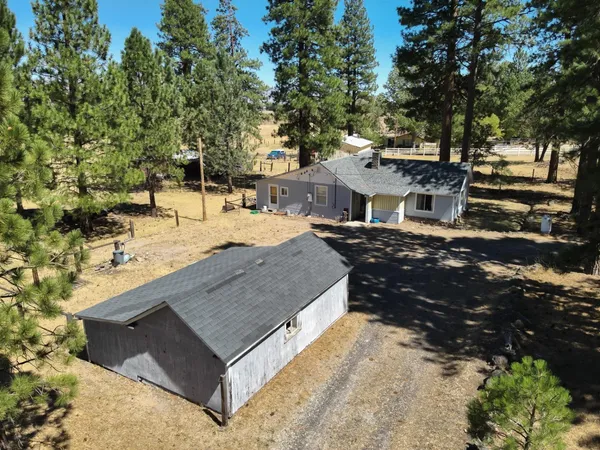 a view of a backyard with sitting area