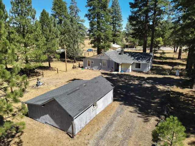 a view of a backyard with sitting area