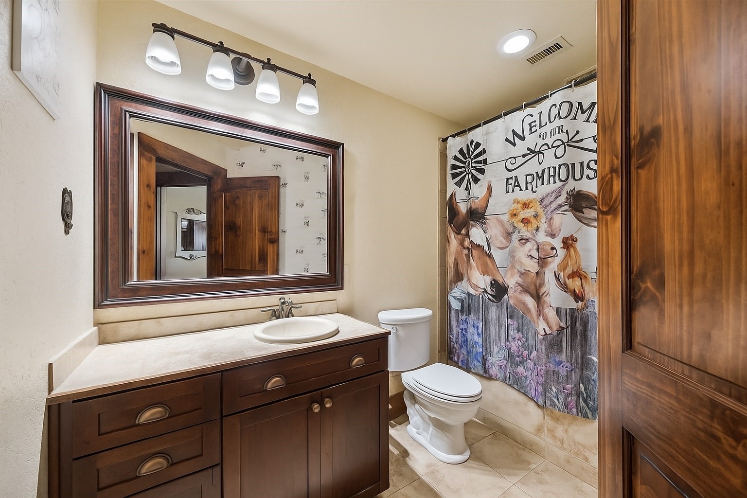 40570 Wildlife Run Hempstead, TX 77445 - Photo 20 of 43 Charming and whimsical, this full bathroom blends rustic farmhouse personality with practical design. The vintage vanity and oversized framed mirror create a space that feels both fun and functional.