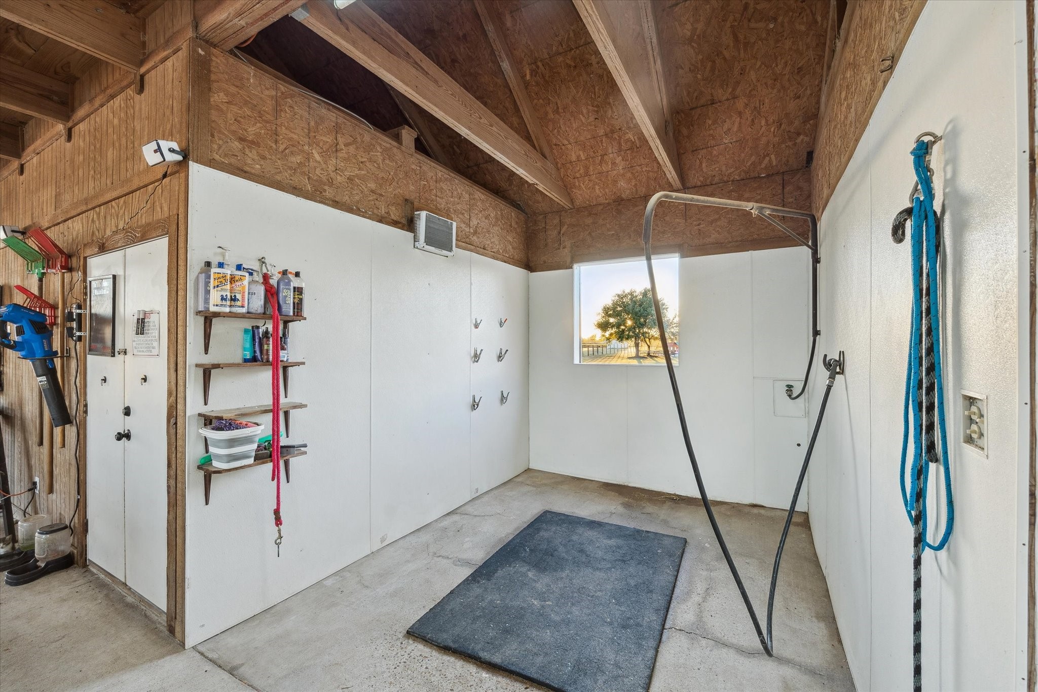 40570 Wildlife Run Hempstead, TX 77445 - Photo 29 of 43 Complete with wall hooks, storage shelves, and a non-slip floor, this indoor wash rack is a premium feature for horse care. Clean and efficient, it’s ideal for grooming, bathing, or prepping before a ride.
