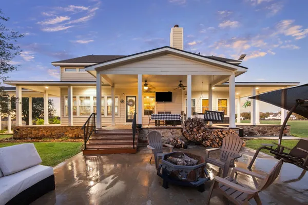 a front view of house with outdoor seating