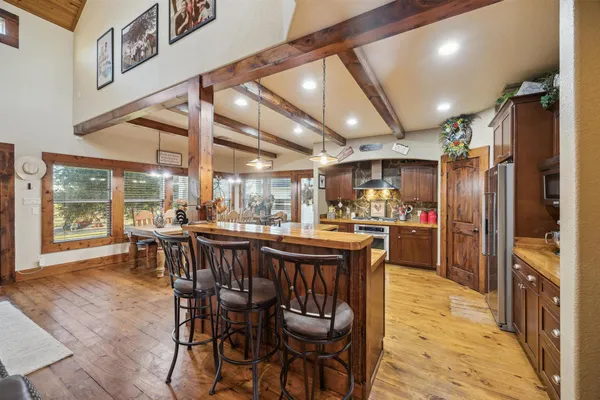 a view of a dining area with furniture window and wooden floor