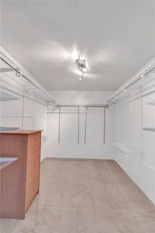 a view of a kitchen with cabinets and a wooden floor