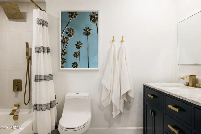 a bathroom with a sink vanity and a mirror