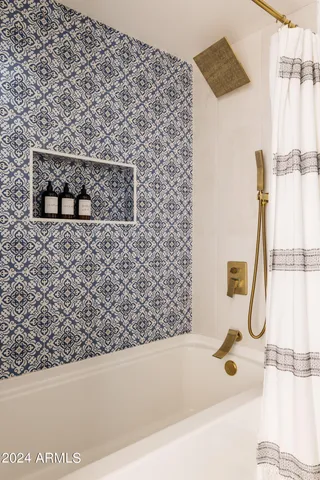 a utility room with cabinets washer and dryer