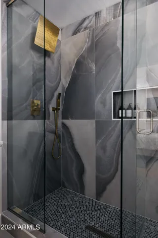 a kitchen with a table chairs refrigerator and cabinets