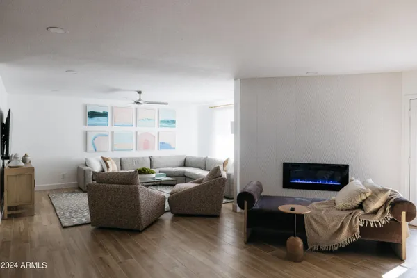 a living room with furniture and a rug