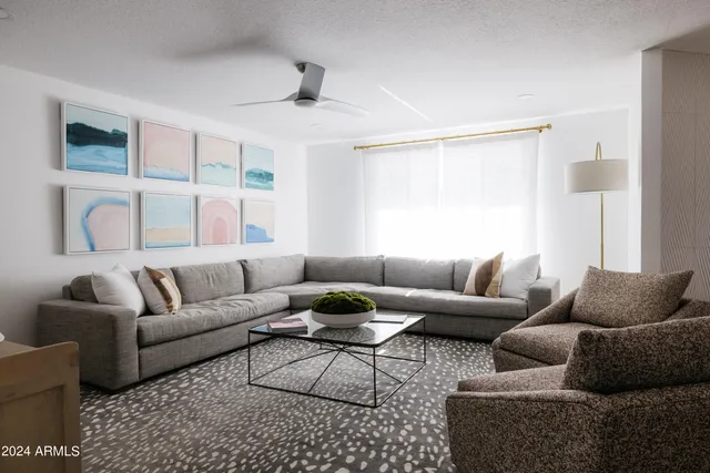a living room with furniture and a table