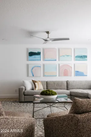 a kitchen with stainless steel appliances granite countertop a table and chairs in it