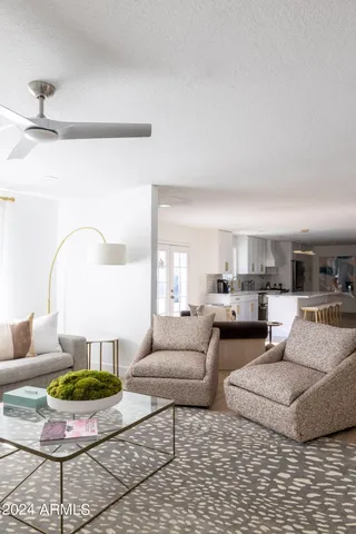 a living room with furniture and a lamp