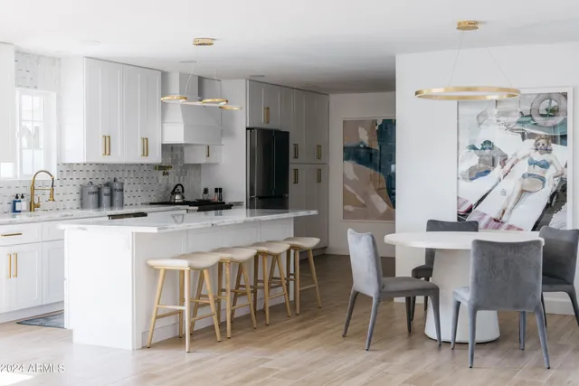 a living room with a couch and a potted plant