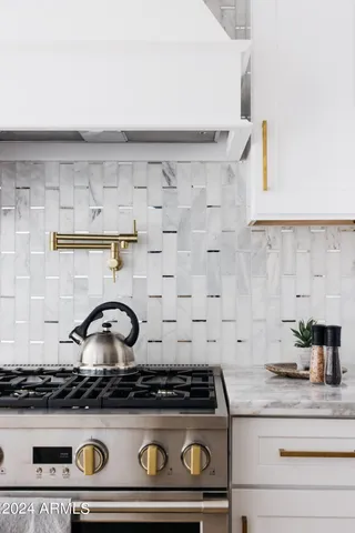 a palm tree sitting in front of a house with a yard