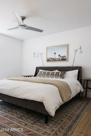 a bedroom with a bed and a dresser