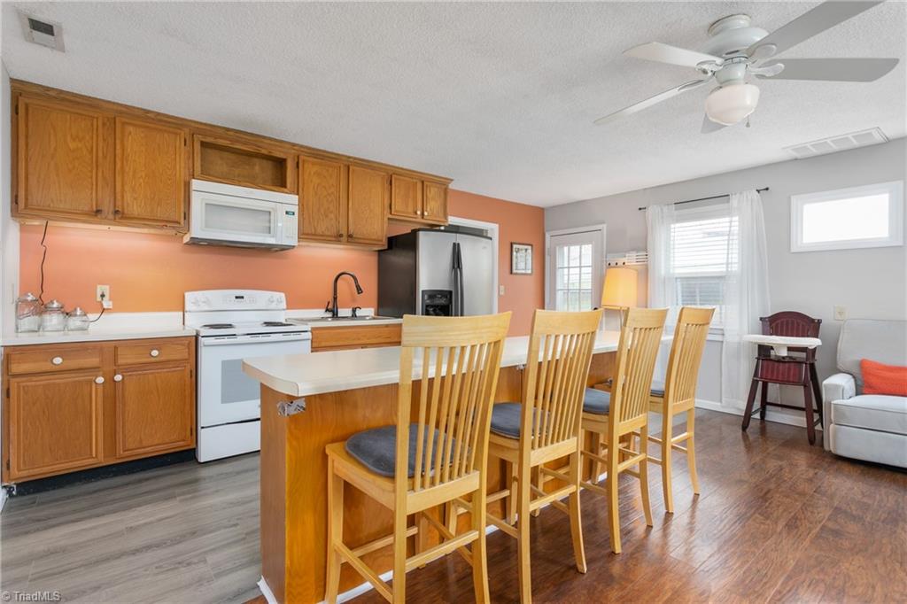 4306 Edgemore Road Greensboro, NC 27455 - Photo 8 of 26 Kitchen with breakfast bar