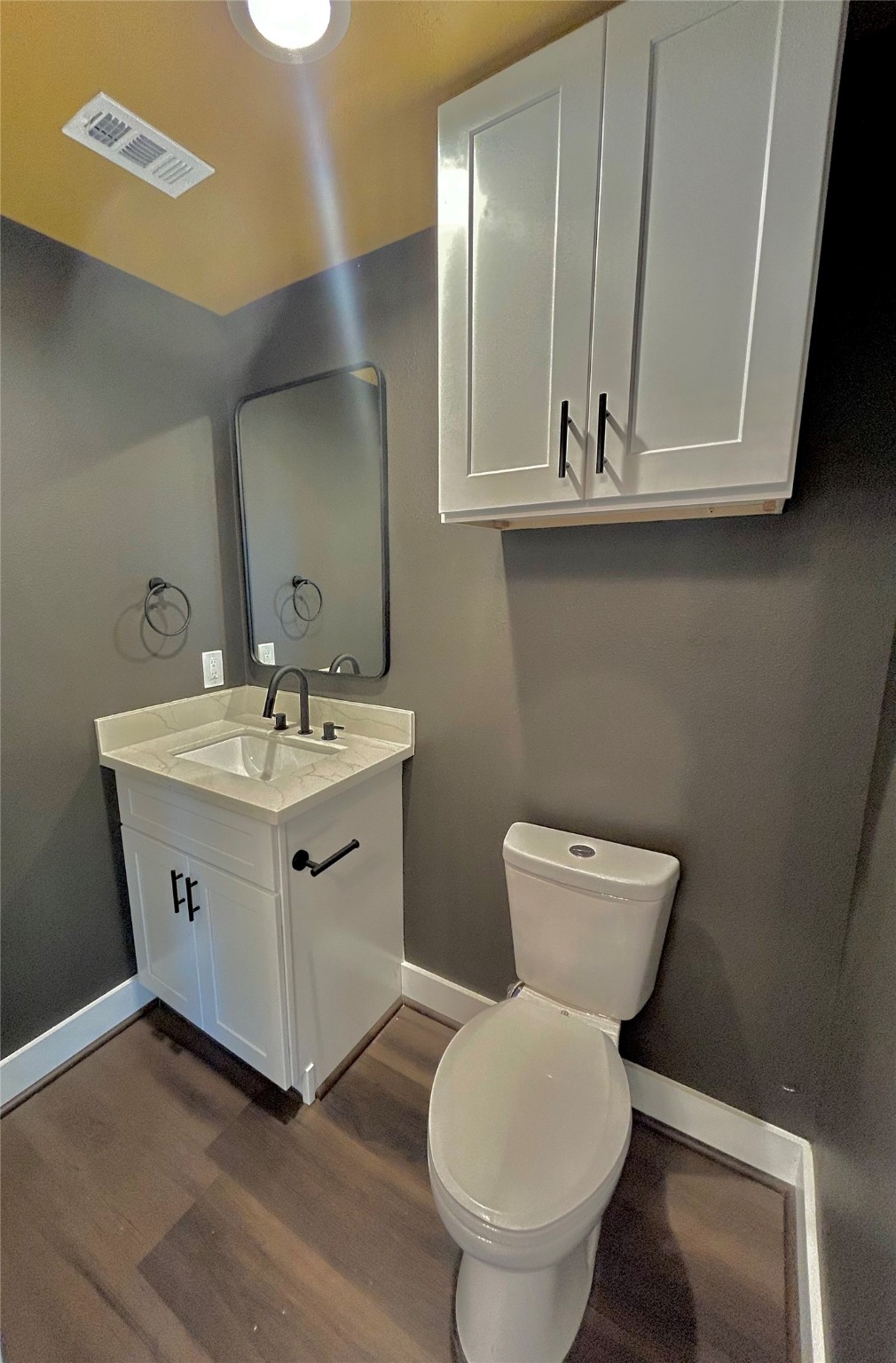 125 4th Street San Leon, TX 77539 - Photo 13 of 40 a bathroom with a toilet sink and mirror