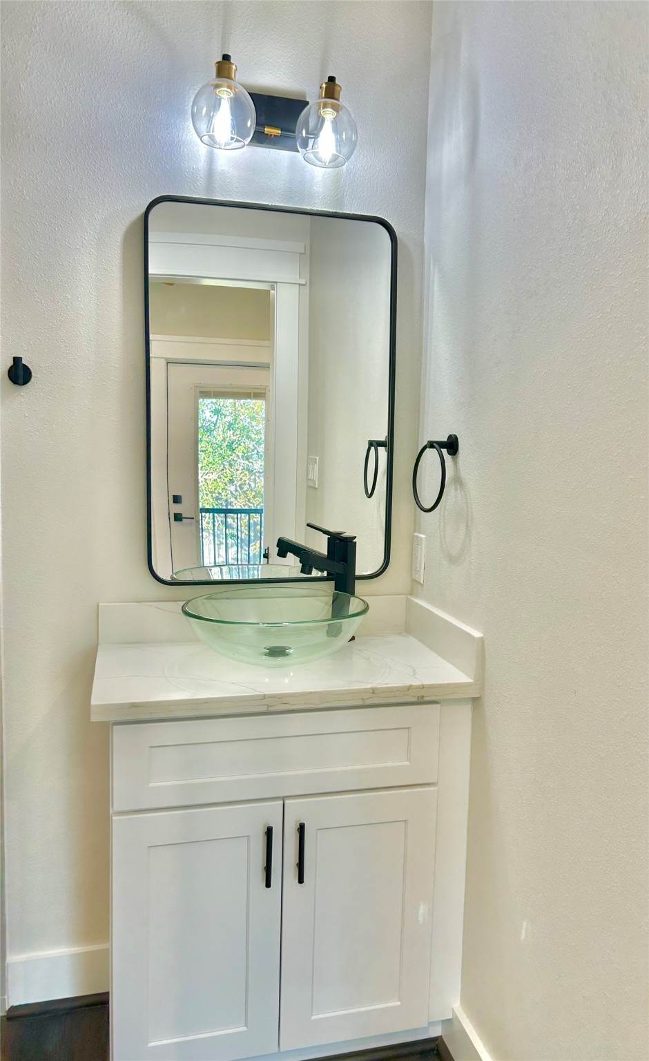 125 4th Street San Leon, TX 77539 - Photo 18 of 40 a bathroom with a sink and a mirror