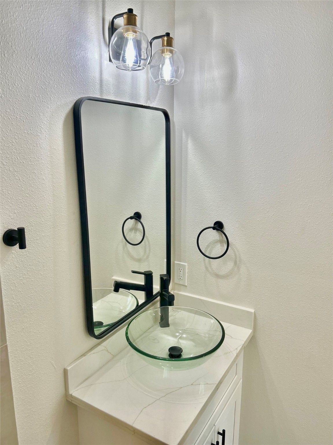 125 4th Street San Leon, TX 77539 - Photo 20 of 40 a bathroom with a sink and mirror