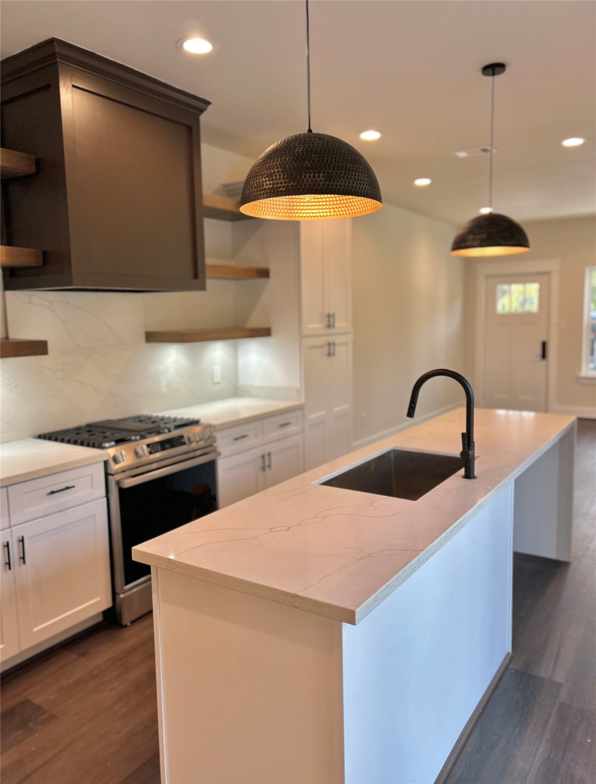125 4th Street San Leon, TX 77539 - Photo 2 of 40 a kitchen with a sink a stove and a microwave