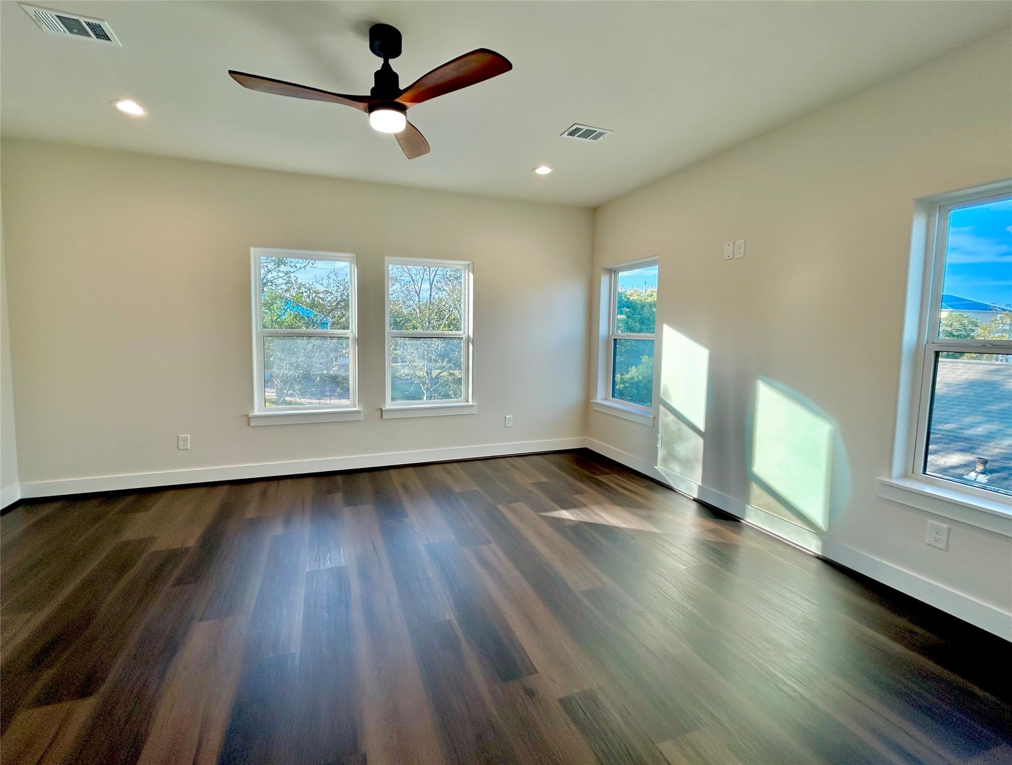 125 4th Street San Leon, TX 77539 - Photo 28 of 40 wooden floor in an empty room with a window